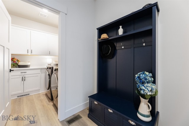 1502 Cyril Way, Belgrade, MT 59714 - mudroom with washing machine and clothes dryer, light wood finished floors, and baseboards