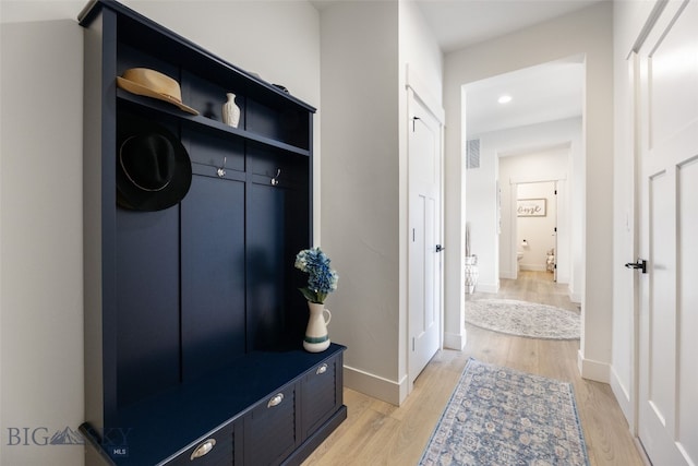 1502 Cyril Way, Belgrade, MT 59714 - mudroom with light wood finished floors, baseboards, and recessed lighting