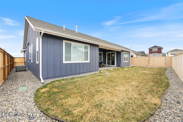 1502 Cyril Way, Belgrade, MT 59714 - rear view of house with board and batten siding, a patio, and central AC unit