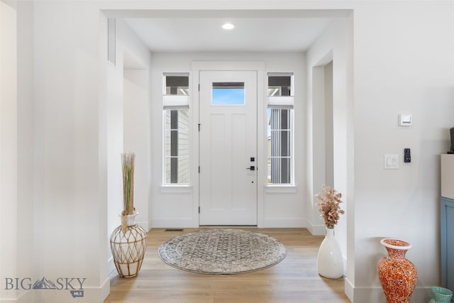 1502 Cyril Way, Belgrade, MT 59714 - entrance foyer with light wood finished floors, plenty of natural light, baseboards, and recessed lighting