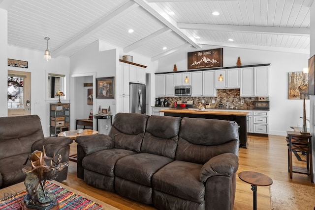 9 Blue Stem Way, Three Forks, MT 59752 - living room with light wood-style flooring, wooden ceiling with exposed beams, and high vaulted ceiling