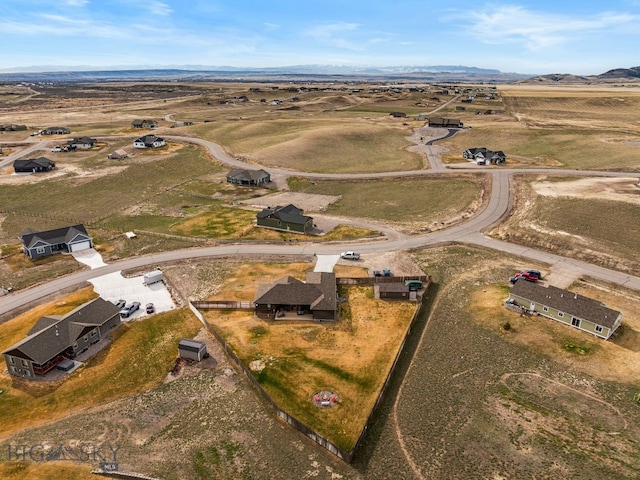 9 Blue Stem Way, Three Forks, MT 59752 - aerial overview of property's location featuring a mountain backdrop and rural landscape