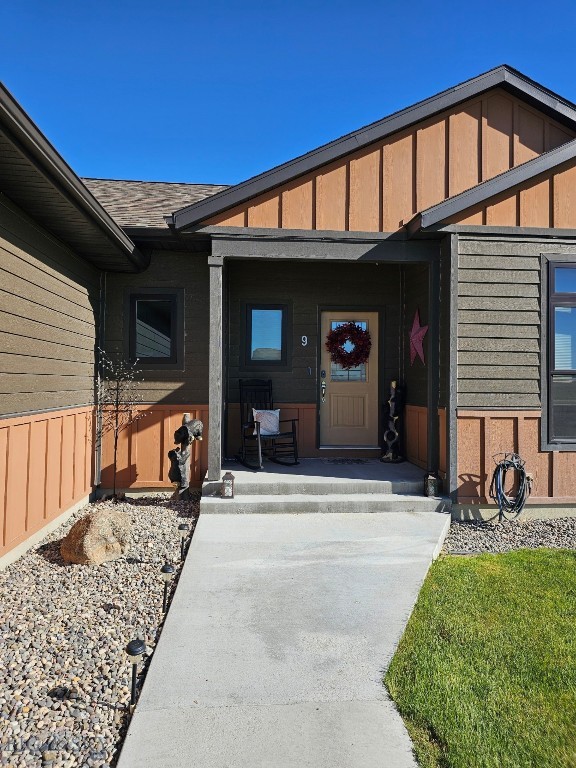 9 Blue Stem Way, Three Forks, MT 59752 - view of exterior entry with a porch and board and batten siding