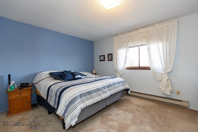 carpeted bedroom featuring a textured ceiling and baseboard heating