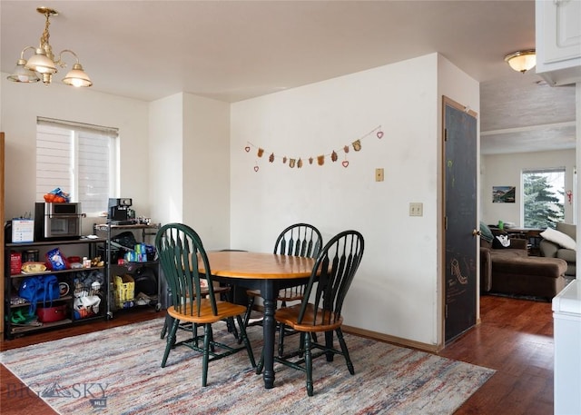 1719 W Kagy, Bozeman, MT 59715 - dining space featuring a notable chandelier and wood finished floors
