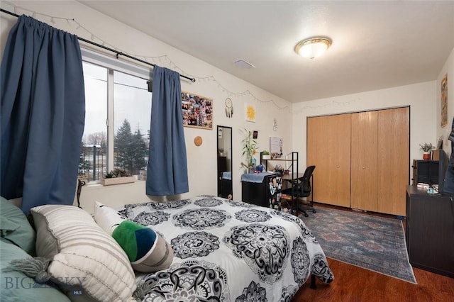 1719 W Kagy, Bozeman, MT 59715 - bedroom with a closet, visible vents, and wood finished floors