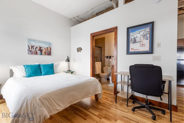67 Village Dr Unit 4A, Belgrade, MT 59714 - bedroom with light wood-style floors and ensuite bath
