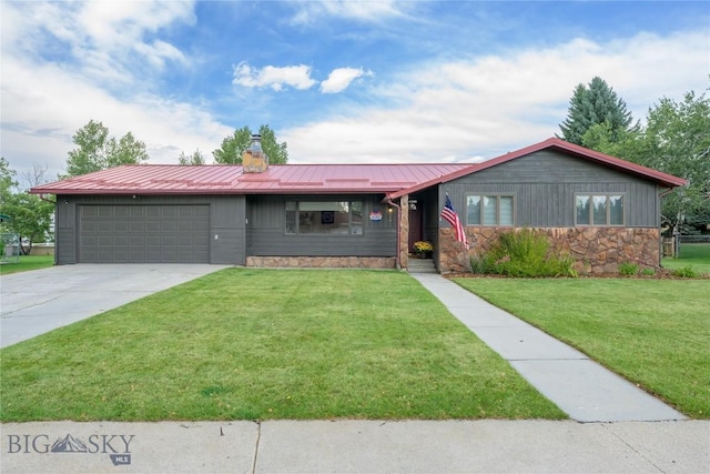 single story home featuring stone siding, metal roof, a garage, a front yard, and driveway