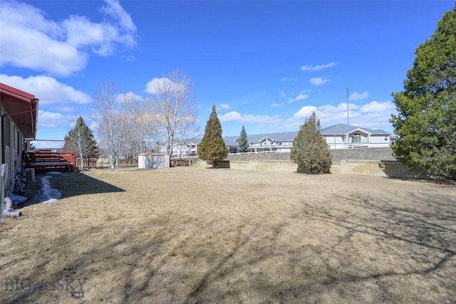 view of yard featuring a storage unit and an outdoor structure