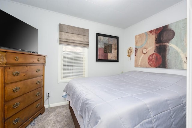 bedroom with carpet flooring, baseboards, and ornamental molding