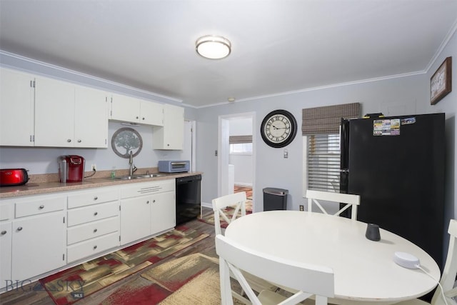 kitchen with crown molding, white cabinetry, a sink, and black appliances