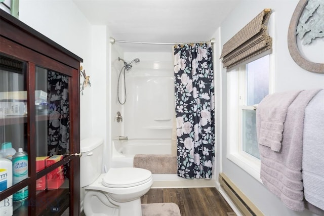 full bath featuring baseboard heating, toilet, wood finished floors, and shower / bath combo