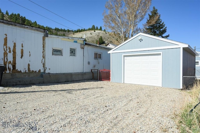 detached garage featuring driveway