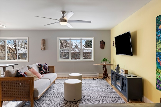 211 N Yellowstone Ave, Bozeman, MT 59718 - living room with healthy amount of natural light, ceiling fan, light wood-style floors, and baseboard heating