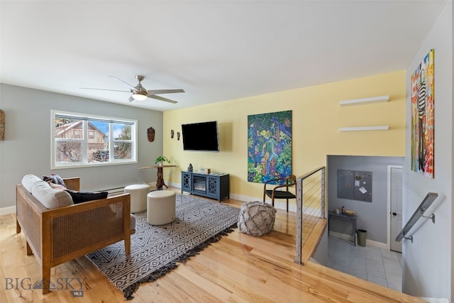 211 N Yellowstone Ave, Bozeman, MT 59718 - living room with a ceiling fan, wood finished floors, and baseboards