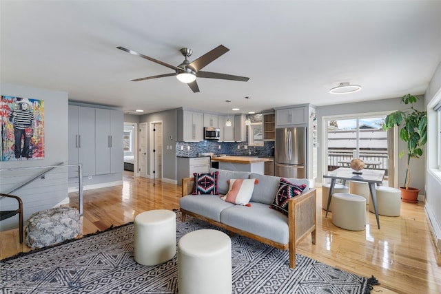 211 N Yellowstone Ave, Bozeman, MT 59718 - living room featuring light wood-style flooring, a ceiling fan, baseboards, and recessed lighting
