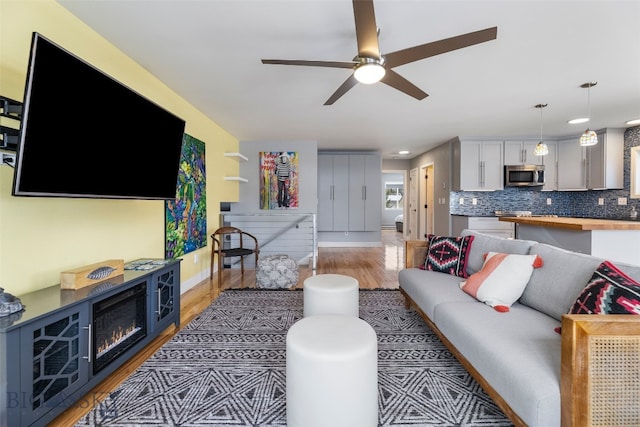 211 N Yellowstone Ave, Bozeman, MT 59718 - living room featuring light wood-type flooring, a ceiling fan, baseboards, and recessed lighting