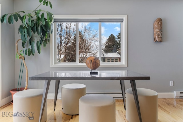 211 N Yellowstone Ave, Bozeman, MT 59718 - dining room with wood finished floors, baseboards, and baseboard heating