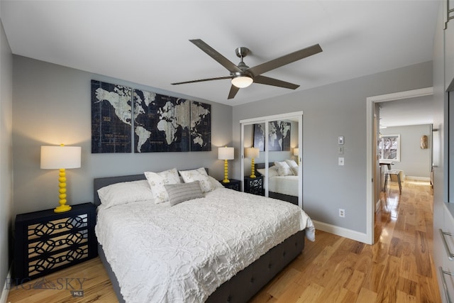 211 N Yellowstone Ave, Bozeman, MT 59718 - bedroom with light wood finished floors, a closet, baseboards, and a ceiling fan