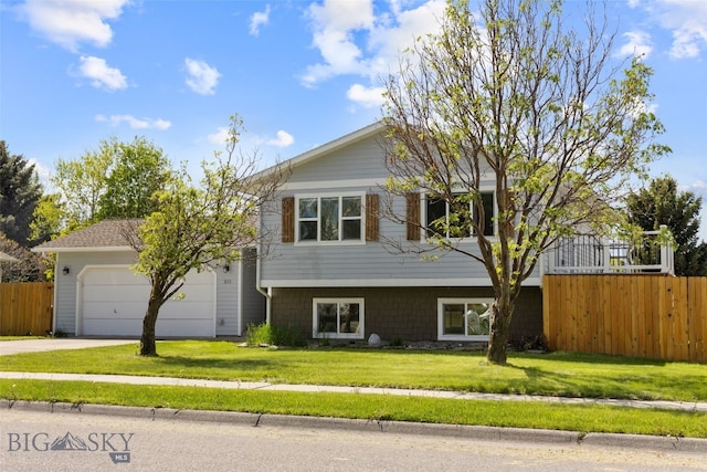 211 N Yellowstone Ave, Bozeman, MT 59718 - tri-level home featuring an attached garage and concrete driveway