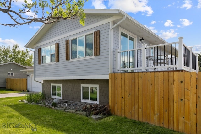 211 N Yellowstone Ave, Bozeman, MT 59718 - view of home's exterior with a garage, a lawn, and driveway