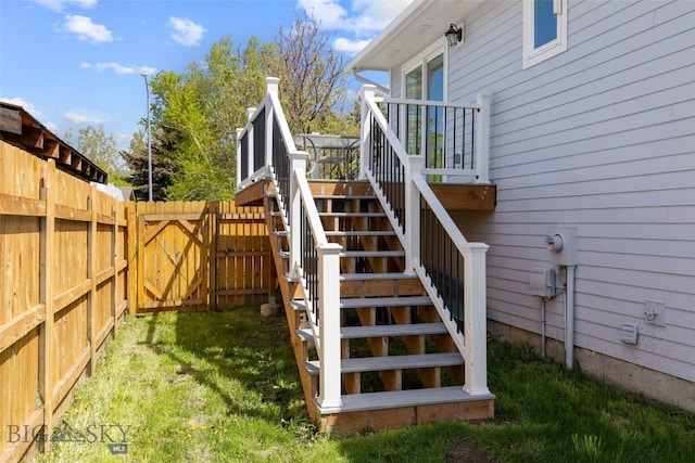 211 N Yellowstone Ave, Bozeman, MT 59718 - wooden deck with stairway, a fenced backyard, and a gate