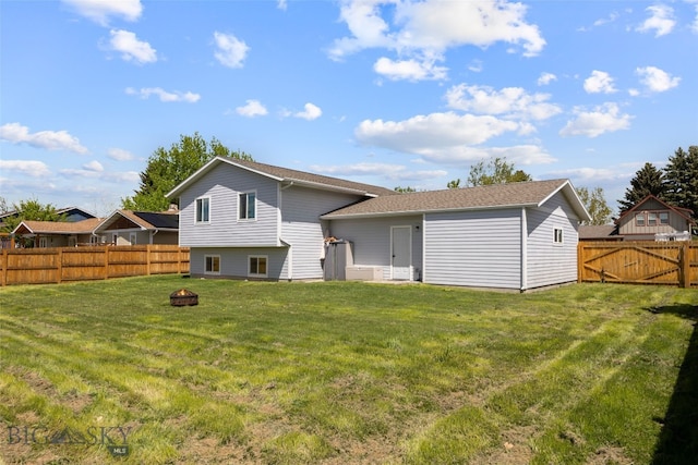 211 N Yellowstone Ave, Bozeman, MT 59718 - rear view of house featuring an outdoor fire pit and roof with shingles