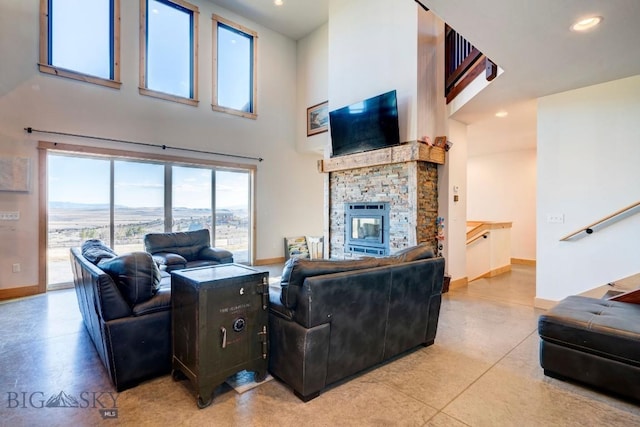 251 Fawn Mdw, Manhattan, MT 59741 - living room featuring a towering ceiling, a fireplace, baseboards, and recessed lighting