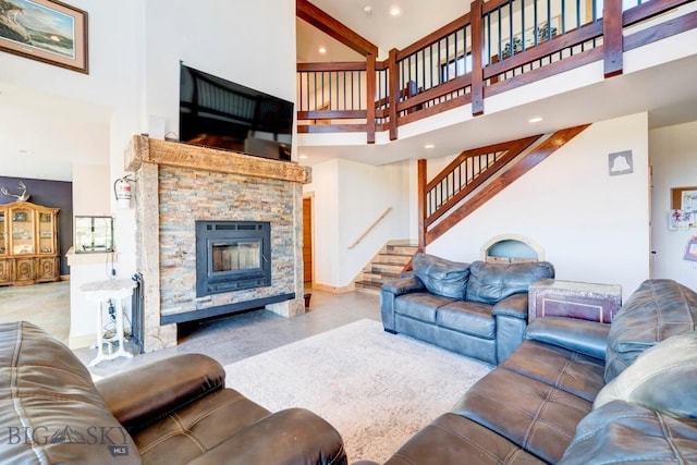 251 Fawn Mdw, Manhattan, MT 59741 - living room with a high ceiling, stairway, a stone fireplace, and recessed lighting