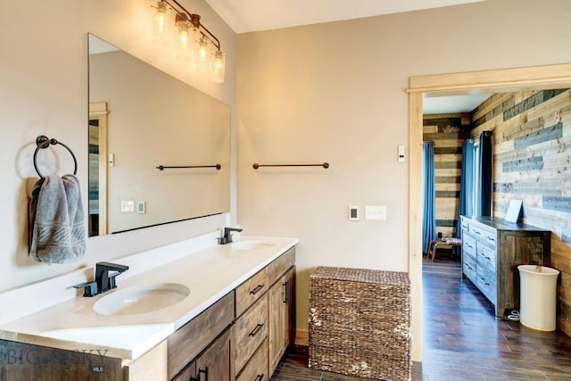 251 Fawn Mdw, Manhattan, MT 59741 - ensuite bathroom with double vanity and wood finished floors