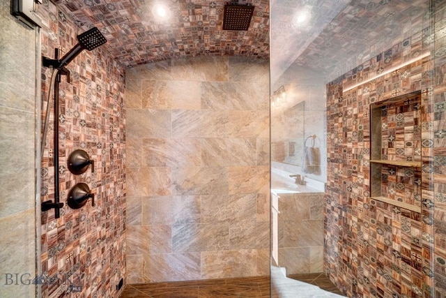 251 Fawn Mdw, Manhattan, MT 59741 - bathroom with a tile shower, tile walls, and brick ceiling