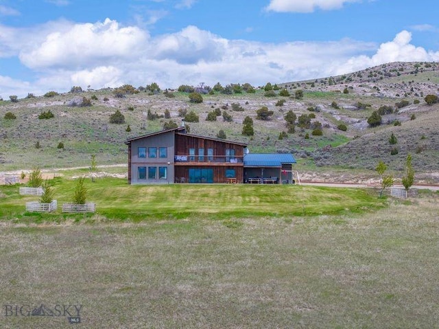 251 Fawn Mdw, Manhattan, MT 59741 - back of property featuring a yard, a view of countryside, and a mountain view