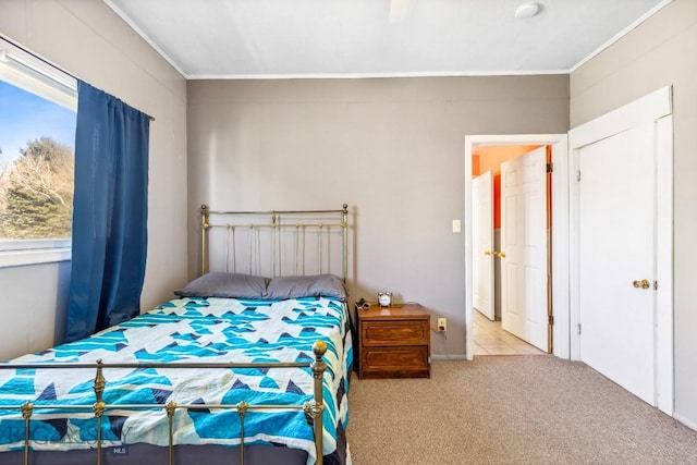 carpeted bedroom with ornamental molding
