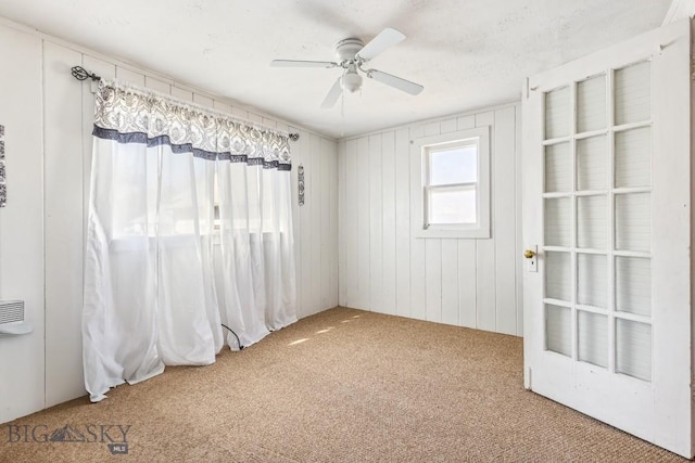 unfurnished room featuring carpet flooring and ceiling fan