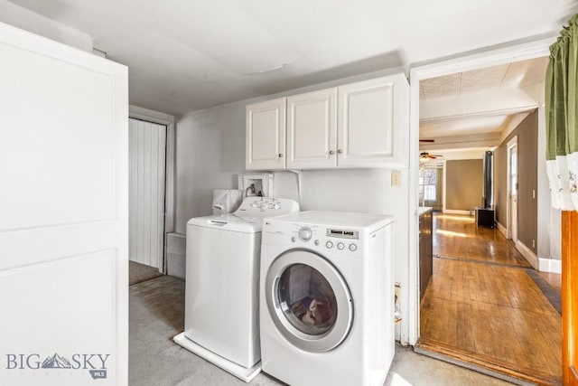 washroom featuring independent washer and dryer, cabinet space, and ceiling fan