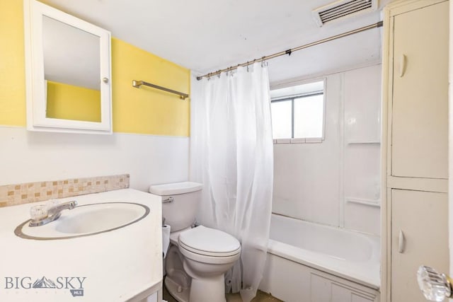 bathroom featuring toilet, backsplash, vanity, shower / bath combo, and visible vents