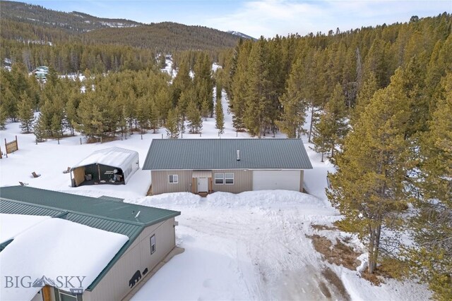 57 Vagabond Ln, Anaconda, MT 59711 - snowy aerial view with a wooded view and a mountain view