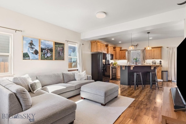 1009 Idaho Unit B, Belgrade, MT 59714 - living room featuring recessed lighting and wood finished floors