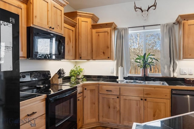 1009 Idaho Unit B, Belgrade, MT 59714 - kitchen with tile countertops, light brown cabinets, black appliances, and a sink
