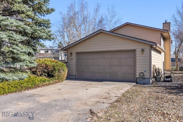 490 Secretariat Cir, Belgrade, MT 59714 - garage featuring driveway