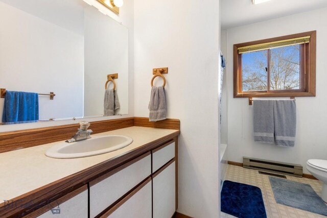 490 Secretariat Cir, Belgrade, MT 59714 - bathroom featuring toilet, baseboard heating, and vanity