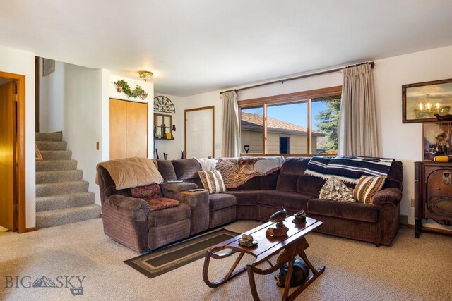 490 Secretariat Cir, Belgrade, MT 59714 - living area featuring carpet floors and stairway