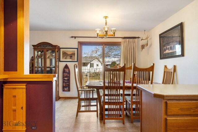 490 Secretariat Cir, Belgrade, MT 59714 - dining space featuring an inviting chandelier