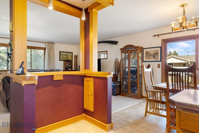 490 Secretariat Cir, Belgrade, MT 59714 - kitchen with decorative light fixtures and tile patterned floors