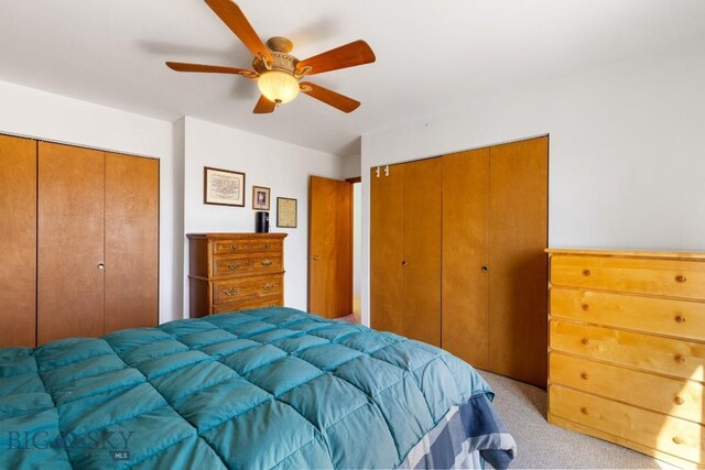 490 Secretariat Cir, Belgrade, MT 59714 - bedroom with light colored carpet, a ceiling fan, and multiple closets