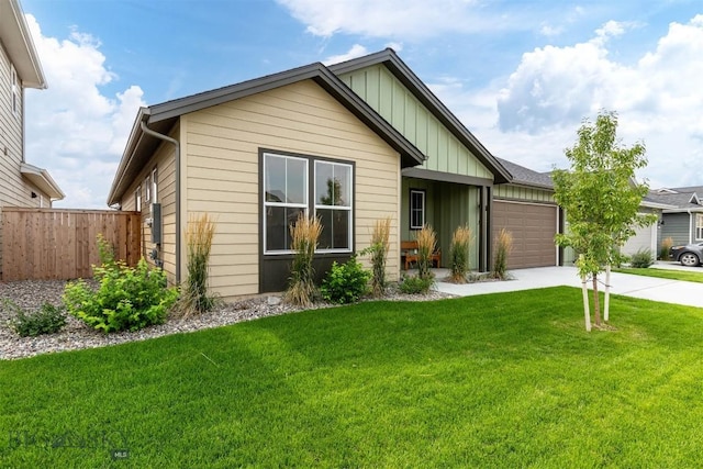1510 Deadwood Loop, Belgrade, MT 59714 - view of front of home featuring board and batten siding, a garage, and concrete driveway
