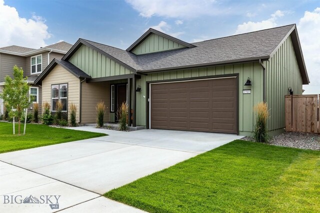 1510 Deadwood Loop, Belgrade, MT 59714 - view of front facade featuring board and batten siding, an attached garage, concrete driveway, and a shingled roof