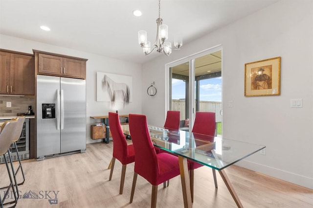 1510 Deadwood Loop, Belgrade, MT 59714 - dining area featuring light wood-style floors, a chandelier, recessed lighting, and wine cooler