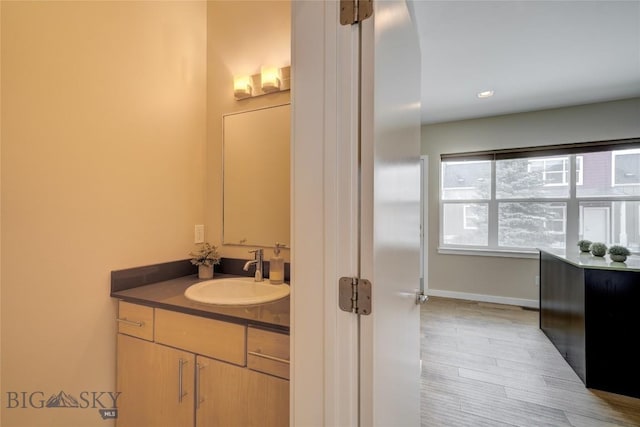 bathroom featuring vanity and wood finished floors