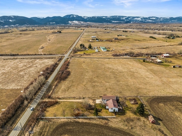 drone / aerial view featuring a rural view and a mountain view